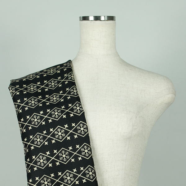 C0655　黒ベース黄土色幾何学模様柄生地